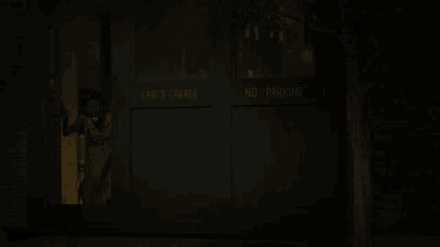 earl 's garage has a no parking sign on its door