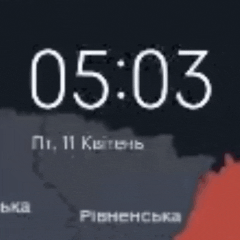 a clock on a cell phone shows the time as 5:03