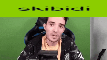 a man is sitting in a chair with a green background and the words skibidi on it .