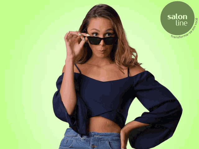 a woman wearing sunglasses stands in front of a green circle that says salon line