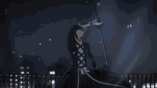 a man in a black suit is holding a sword over his head