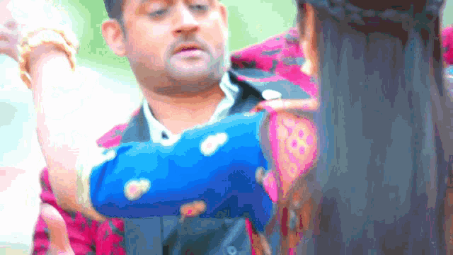 a man and woman are standing next to each other