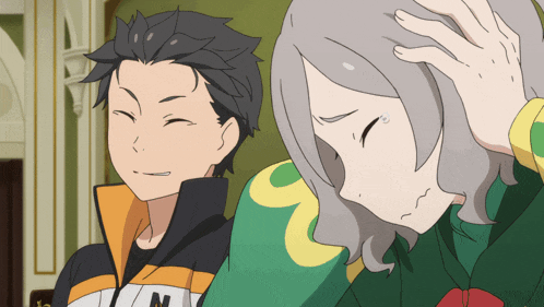 a man and a woman are standing next to each other and the man is wearing a jacket with the letter n on it