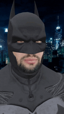 a man with a beard is wearing a batman costume
