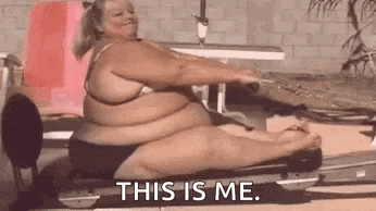a very fat woman is sitting on a treadmill and saying `` this is me '' .