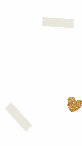 a blurry picture of a woman in a black dress with a gold heart in front of her