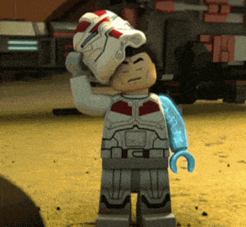 a lego figure with a blue arm and a helmet on his head
