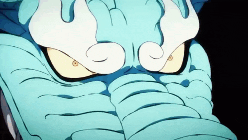 a close up of a cartoon elephant 's face with yellow eyes