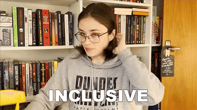 a woman wearing glasses and a dundee inclusive hoodie
