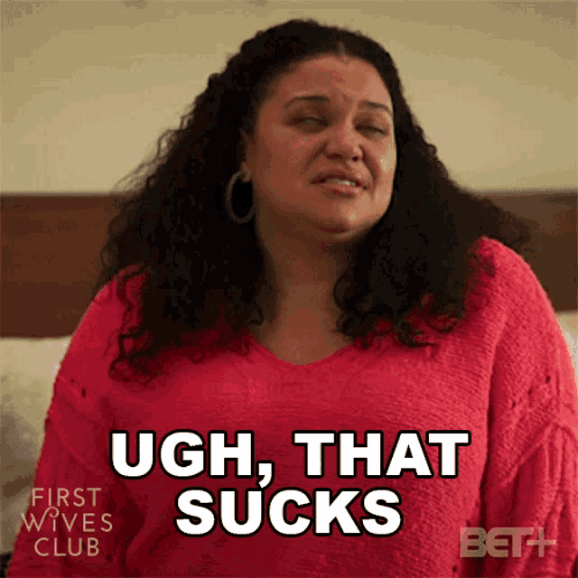 a woman says ugh that sucks while wearing a red shirt