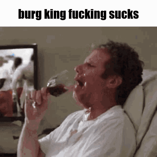 a man drinking a glass of wine with the words burg king fucking sucks below him