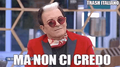 a man wearing red sunglasses and a red jacket says trash italiano