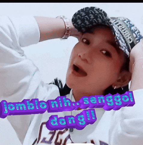a woman wearing a baseball cap and a sweatshirt with the word dong on the bottom
