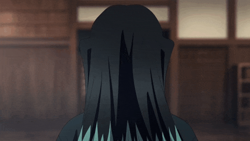 a girl with long black hair and blue eyes