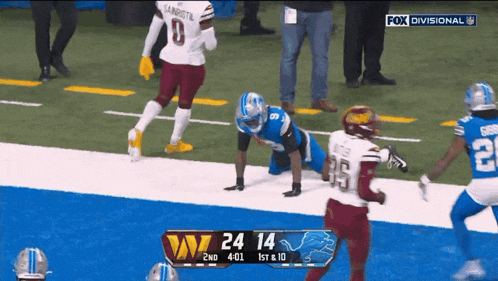 a football game between the detroit lions and the redskins