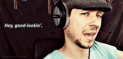 a man wearing headphones says hey good-lookin