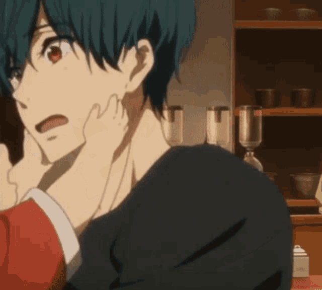 a man with blue hair is being held by a woman
