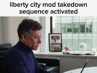 a man is sitting at a table with a laptop and a window in the background .