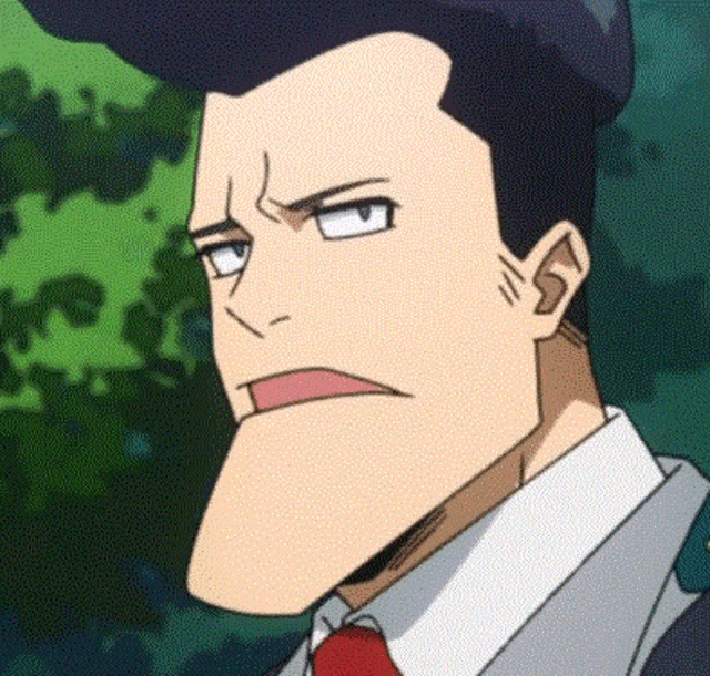 a man in a suit and tie is making a face .