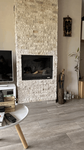 a living room with a fireplace and a crate that says cacao on it