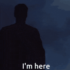 a man in a superman costume with the words i 'm here above him