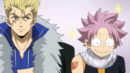 a man and a boy are standing next to each other and the boy has a fairy tail tattoo on his arm