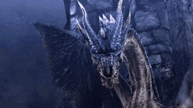 a dragon is standing in front of a stone wall and looking at the camera