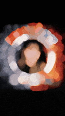a blurry picture of a woman 's face is surrounded by a circle