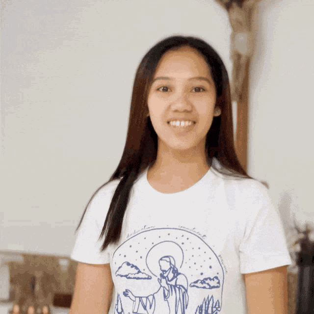 a woman in a white shirt with the letter n on the bottom right