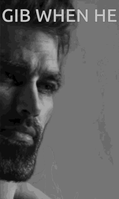 a black and white photo of a man with gib when he written on the top