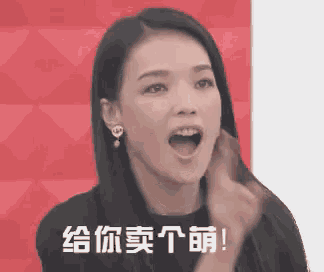 a woman is making a funny face with her mouth open in front of a red background .