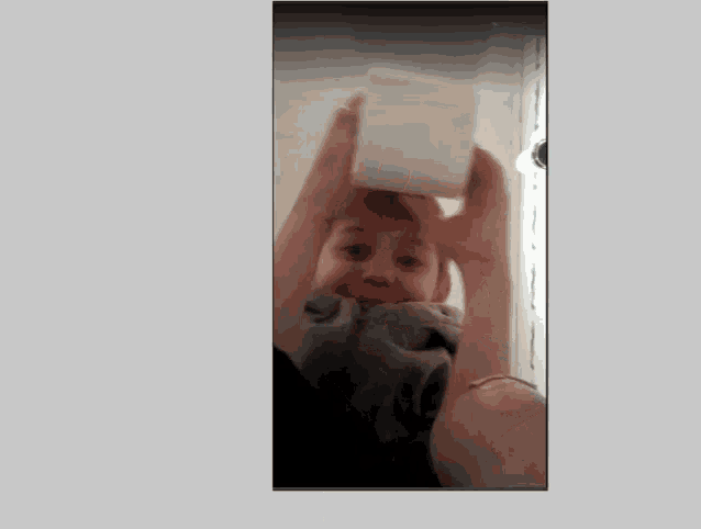 a person is holding a cube in their hands