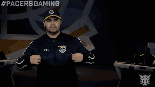 a man wearing a hat and a jacket with #pacersgaming written above him