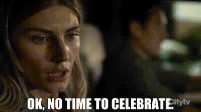 a woman says ok no time to celebrate in a pixelated image .