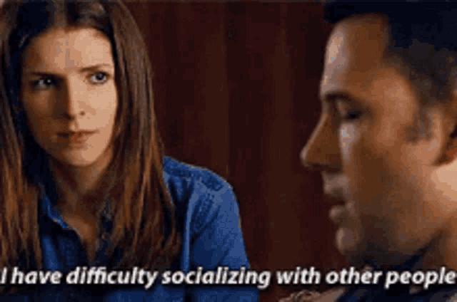 a man and a woman are talking to each other and the woman says i have difficulty socializing with other people .