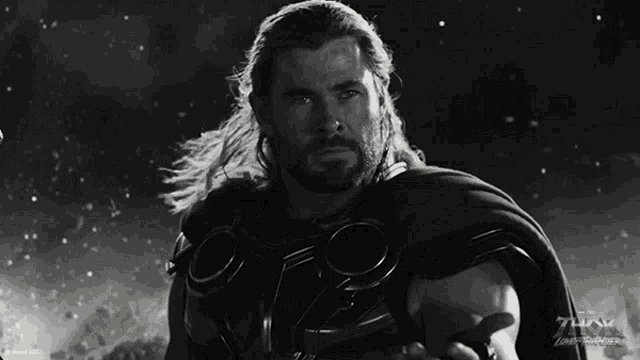 a black and white photo of a man with the word thor on it