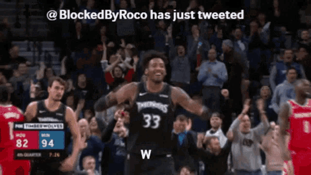 a basketball player with the number 33 on his jersey is celebrating