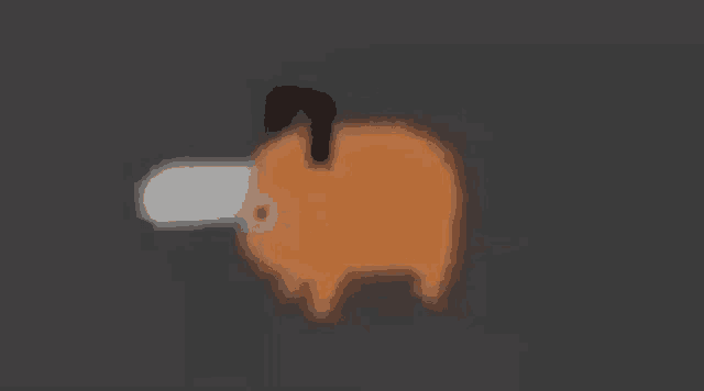 a blurred image of a piggy bank with a candle sticking out of it