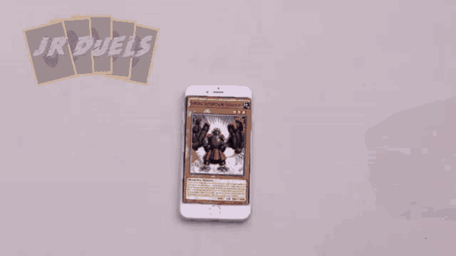 a cell phone with a hole in it and the words jr duels on the top