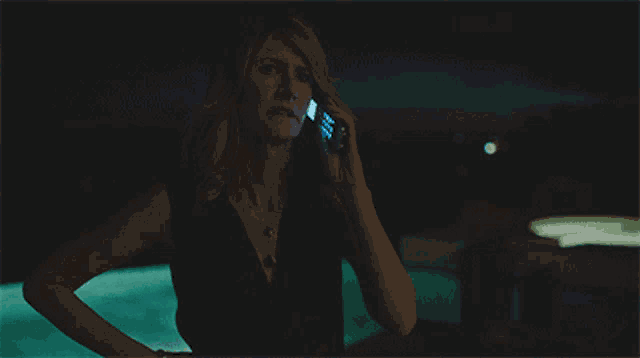 a woman talking on a cell phone with the words " you 're dead in this town " below her