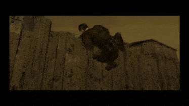 a man is kneeling in front of a wooden fence in a video game