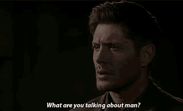 a man is talking to another man in a dark room and says what are you talking about man .