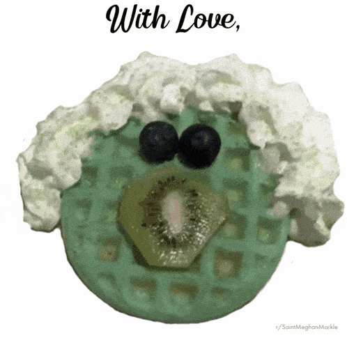 a green waffle with whipped cream blueberries and a kiwi on it