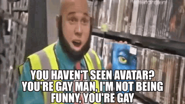 a bald man with a beard is holding a blue avatar movie