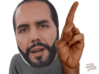 a man with a beard is pointing up with jr jab written on the bottom right