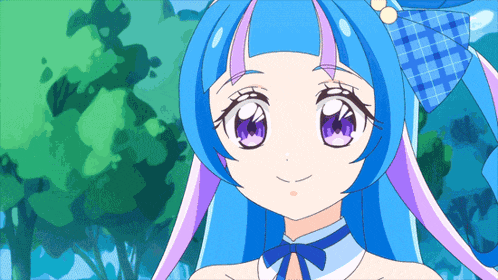 a girl with blue hair and purple eyes is smiling for the camera