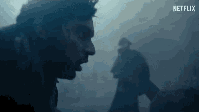 a close up of a man 's face in a foggy room .
