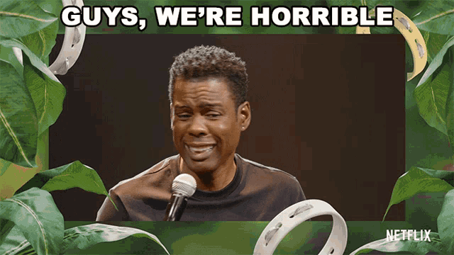 a picture of a man with a microphone and the words guys we 're horrible above him