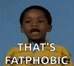 a young boy in a yellow jacket is looking up with the words `` that 's fatphobic '' .