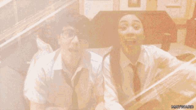 a boy and a girl are standing next to each other with their mouths open ..